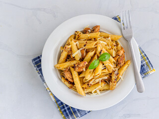 Chicken Penne Pasta Garnished with Fresh Basil Top Down Italian Food Photo