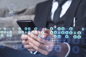 Hands of hr specialist browsing social networks in the Internet in smart phone to find the best candidates to hire international team. Concept of success. Media hologram icons. Formal wear.