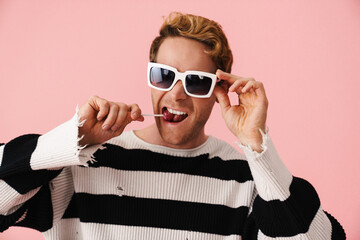 Happy mid aged blonde gay man in sunglasses