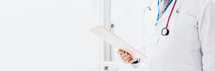 Doctor reading a coronavirus patient medical chart