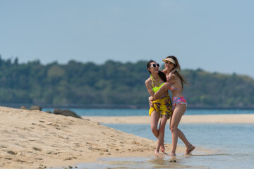 Fototapeta premium Portrait of thai woman posing outdoors at the sea beach
