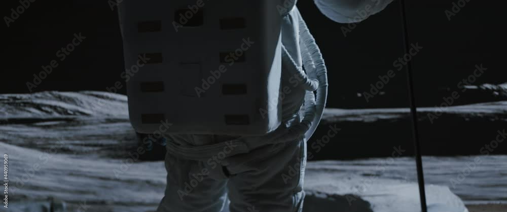 Wall mural portrait of asian lunar astronaut placing a flag pole on the moon surface. easy to track and add you