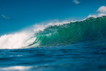 Turquoise wave in sea. Breaking wave in sunny day