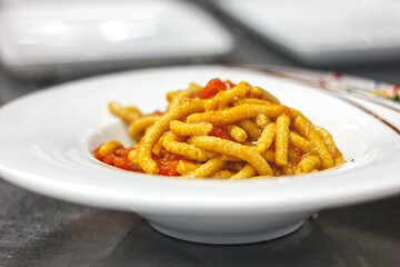 Passatelli, fresh pasta made with Parmigiano Cheese, bread crumbs and clove