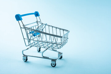 A shopping cart on a blue background