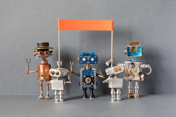 Robots are holding a picket, a strike for the observance of rights. Group of different robots with...
