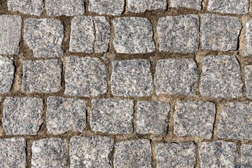 Grey stone background. Ancient stone pavement.