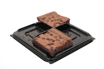 Chocolate chip brownie squares on white.
