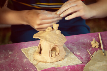Having fun with colorful modeling clay. Creative kids molding at home.