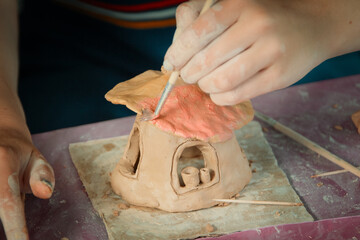 Having fun with colorful modeling clay. Creative kids molding at home.