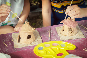 Having fun with colorful modeling clay. Creative kids molding at home.
