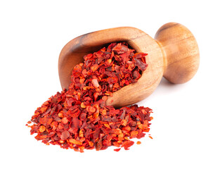 Dried red chili flakes in wooden scoop, isolated on white background. Chopped chilli cayenne pepper. Spices and herbs. - Powered by Adobe
