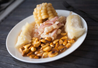 Peruvian traditional dish.fish ceviche with yuka and corn