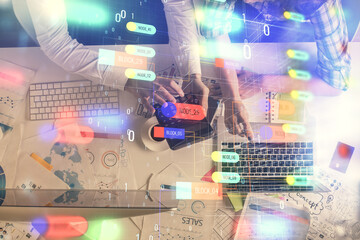 Double exposure of man and woman working together and data theme hologram drawing. Computer background. Top View.