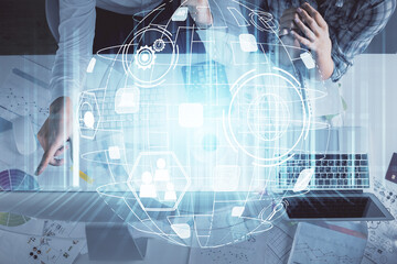 Double exposure of man and woman working together and social network theme hologram drawing. Computer background. connecting concept. Top View.