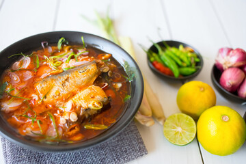 Delicious salad canned fish with vegetables of herbs, lemon, lemongrass, kaffir lime leaves, Shallot, pepper. The simple, homemade cooking menu during the quarantine concept Thai food. Top view