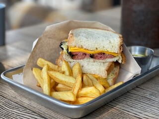 meat sandwich and fried potatoes