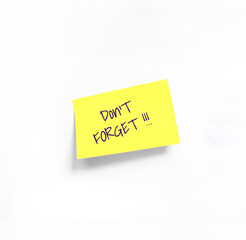 Isolated Yellow sticker with Don't forget Handwriting text on white Whatman paper. Concept programming, testing, business. Handwriting text, copy space