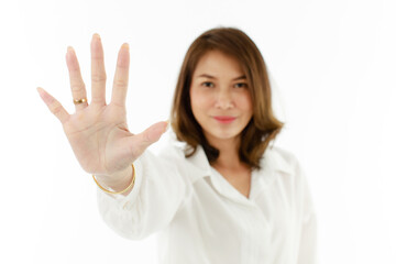 Portrait of Asian woman showing his five fingers for number 5 or prohibit, refuse manner. Selective...