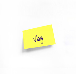 Isolated Yellow sticker with Vlog Handwriting text on white Whatman paper. Concept programming, testing, business. Handwriting text, copy space