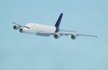 Airplane model on blue background. Travel and transportation concept. 	