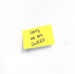 Concept programming, testing, business. Handwriting text, copy space. Isolated Yellow sticker with Sorry we are closed Handwriting text on white Whatman paper.