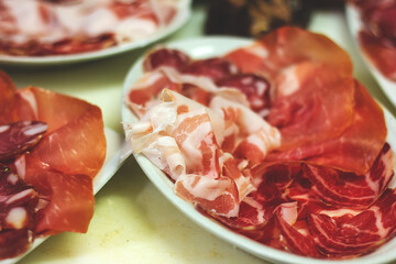 Cold dish of Parma ham, salami and lard