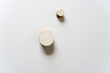 round wooden shapes on paper