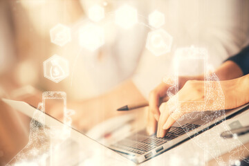 Double exposure of woman hands typing on computer and technology theme drawing. High Tech concept.