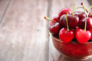 natural red cherry fruit with green peduncle
