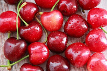 natural red cherry fruit with green peduncle