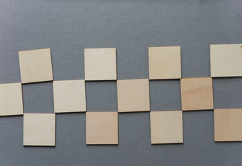 wooden shapes on medium grey background