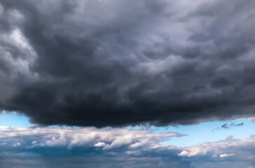 Panoramic view of beautiful thunderclouds. Beautiful dramatic  blue sky background. Rainy weather. Soft focus photo.