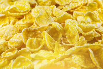 Yellow Cornflakes close up photo, Food texture background, top view. Macro shot. Perfect breakfast.