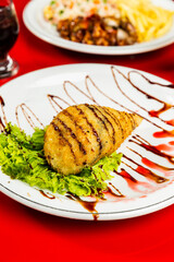 Delicious Sushi Temaki Hot Fried Tuna Salmon Fish Dish On a Red Table