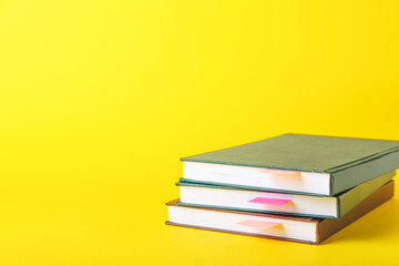 Books with bookmarks on color background