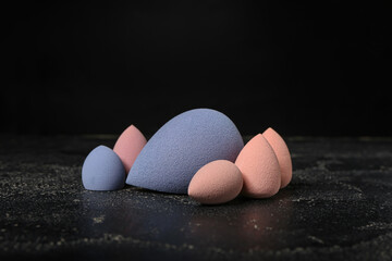 Makeup sponges on dark background