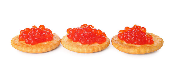 Tasty crackers with red caviar on white background