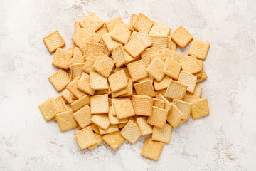 Tasty crackers on light background