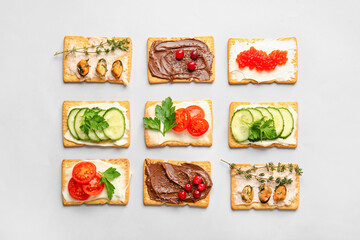 Different crackers on grey background