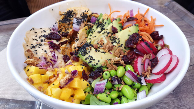 Poke bowl with chicken, rice and vegetables