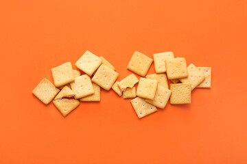 Tasty crackers on color background