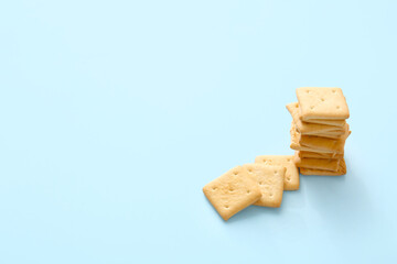 Tasty crackers on color background