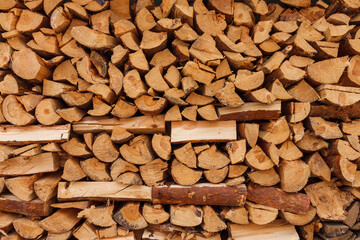Firewood stacked. Chipped firewood. Preparation to winter season. Background
