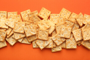 Tasty crackers on color background