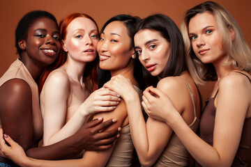 Obraz premium young pretty caucasian, afro, asian, scandinavian woman posing cheerful together on brown background, lifestyle diverse nationality people concept