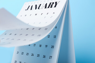 Flip calendar with page of January on color background, closeup - obrazy, fototapety, plakaty