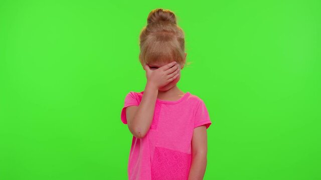 Upset bored children girl crying and starting squeezing presses colorful anti-stress touch screen push pop it popular toy to calm down. Chroma key. Trendy fidgeting sensory game for stressed child kid