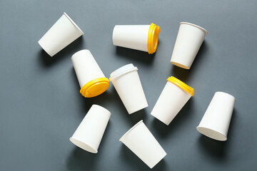 Takeaway cups for coffee on dark background