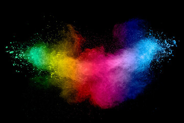 Colorful background of pastel powder explosion.Rainbow color dust splash on black background.